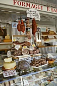 Market stall selling sausages and cheese in Italy