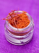 Saffron threads and saffron powder in screw-top jar