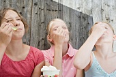Three girls eating ice cream