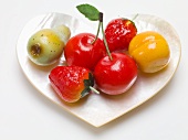 Marzipan fruit in heart-shaped mother-of-pearl dish