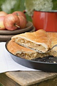 Apple pie on a wooden table out of doors