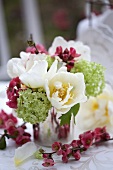 A bouquet of tulips, viburnums and japonica