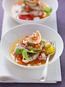 Fried seafood on tomato jelly with basil cream