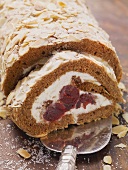 Cinnamon roulade with cherry compote filling