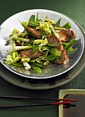 Pork chops with spring onions and mangetout