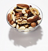 Glass bowl of nuts and raisins