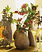 Lenten roses, white wine and antique candlestick