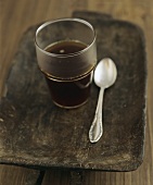 A glass of black coffee