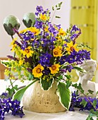 Delphiniums, Coreopsis, Hosta leaves and lady's mantle