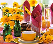 Summery table laid for coffee, with sunflowers