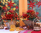Arrangement of ornamental peppers and rose hips