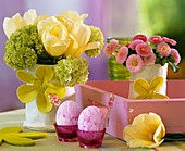 Table decoration: coloured eggs, tulips, Viburnum & daisies