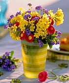 Cowslips, daisies and forget-me-nots in ringed vase