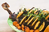 Leg of lamb with oranges, rosemary and carrots