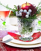 Christmas arrangement with apple on plate