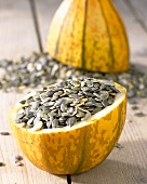 Pumpkin seeds in hollowed-out pumpkin