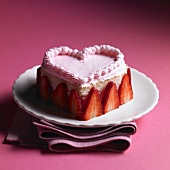 Heart-shaped sponge cake with strawberry cream