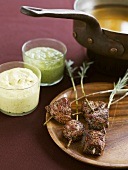 Fondue with lamb and various dips