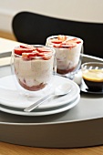 Strawberry tiramisu in glasses with espresso on a tray