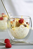 Muesli with soft cheese and fruit in a glass