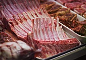 Racks of lamb on a meat counter