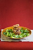 Fried beetroot slices with walnut crust and corn salad