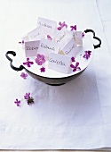 Place cards with purple flowers