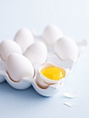 White eggs, one cracked open