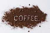 The word COFFEE written in ground coffee