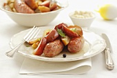 Sausages with apples and juniper berries