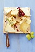Various cheeses with grapes and nuts
