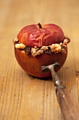 Baked apple speared on a fork