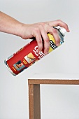 Making a console table (spraying the wooden frame with spray adhesive)