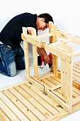 Making a wooden folding table (attaching the legs to the tabletop)