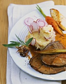 Leg of lamb with mashed potato and radishes