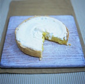 Lemon meringue tart, a piece taken