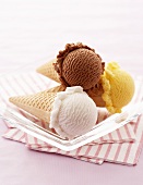 Ice cream cones with three different flavours of ice cream
