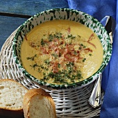 Mustard cream soup with ham and cress