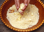 Fluffing couscous by hand