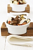 Beef with ratatouille in small bowls