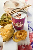 Vegetable tempura with yoghurt dip and Indian flatbread