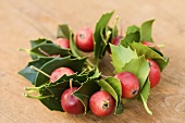 Christmas wreath of holly leaves and ornamental apples