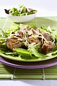 Tuna with sprouts on lettuce leaves