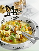 Vegetable stew with pasta and mini-sausages