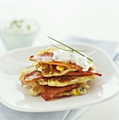 Corn pancakes and bacon with sour cream