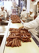 Workers in a Chinese sausage factory