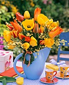 Tulips and broom in blue jug