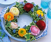 Wreath of ranunculus, ivy and grape hyacinths