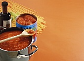 Still life with ingredients for spaghetti with tomato sauce