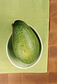 A avocado in a dish